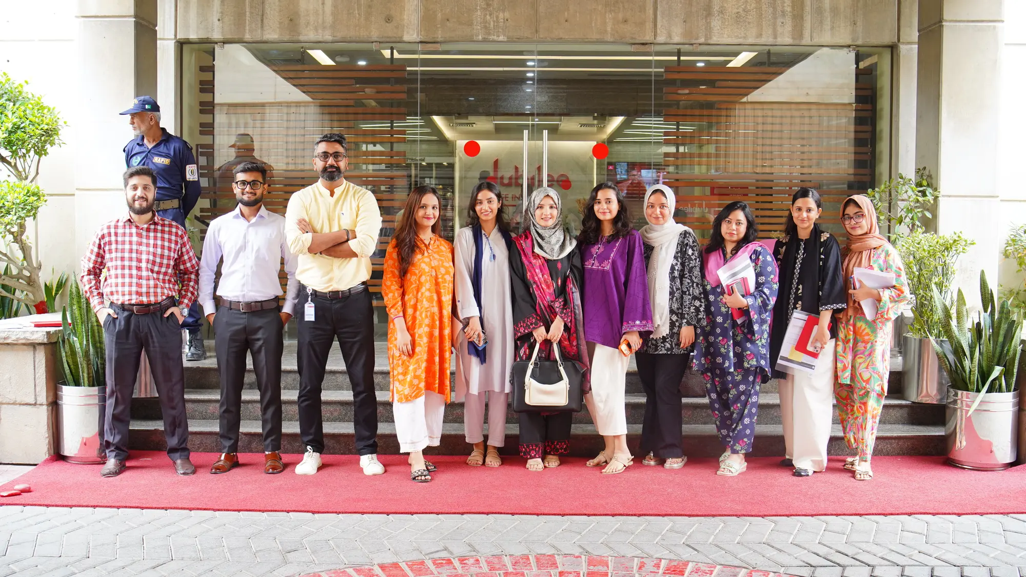 The Jubilee Life HR team standing outside the office entrance after the session.